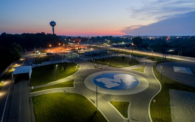 An aerial view of the University of Michigan autonomous vehicle testing facility at night.